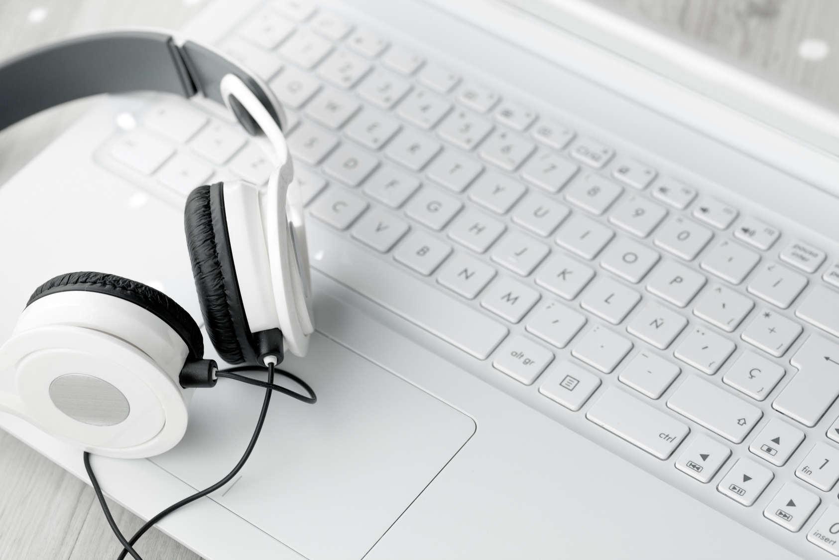 White laptop and headphones